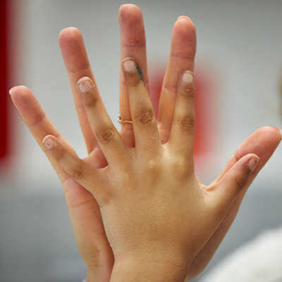 A close up of two hands touch each other