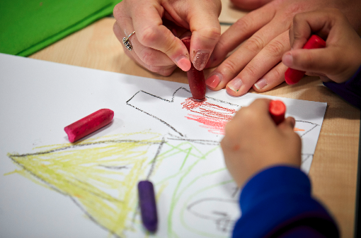 A child colouring in a picture