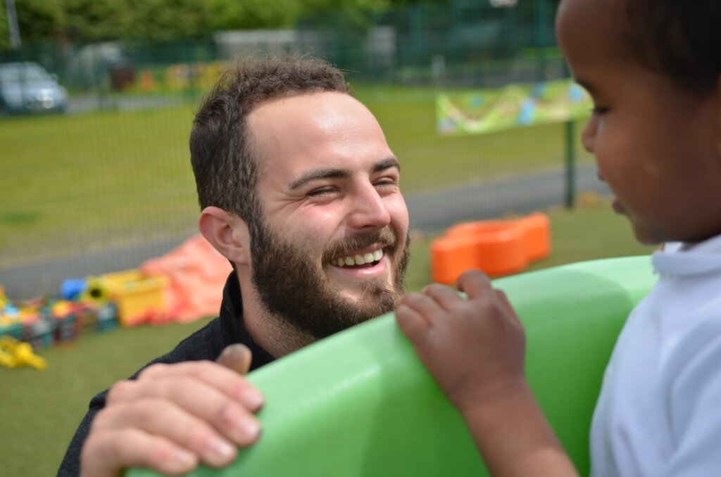 male teacher smiling