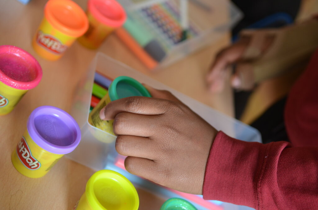 Child playing with Play-Doh