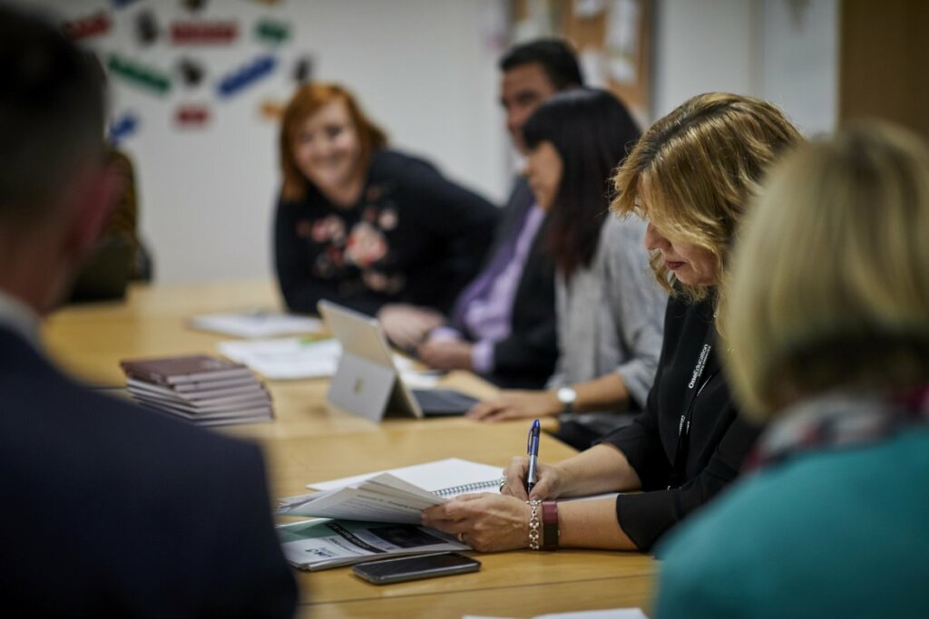 School leaders and teaching staff at a meeting.