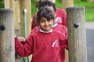 Girl pupil smiling in playground
