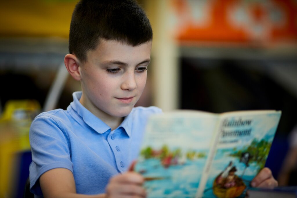 A boy reading a book.