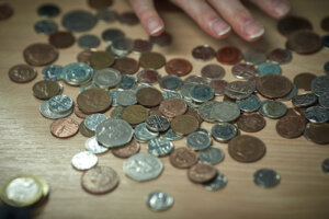 Coins scattered on a table.