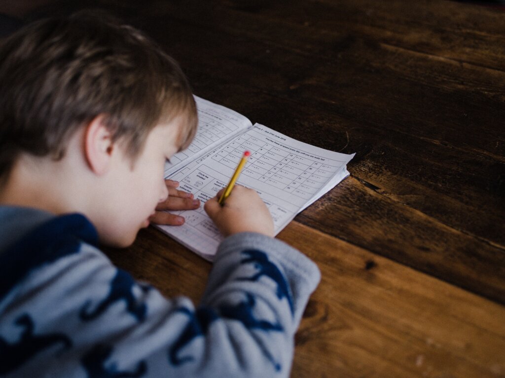 A boy completing homework.