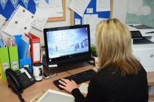 Woman working on a laptop computer in an office