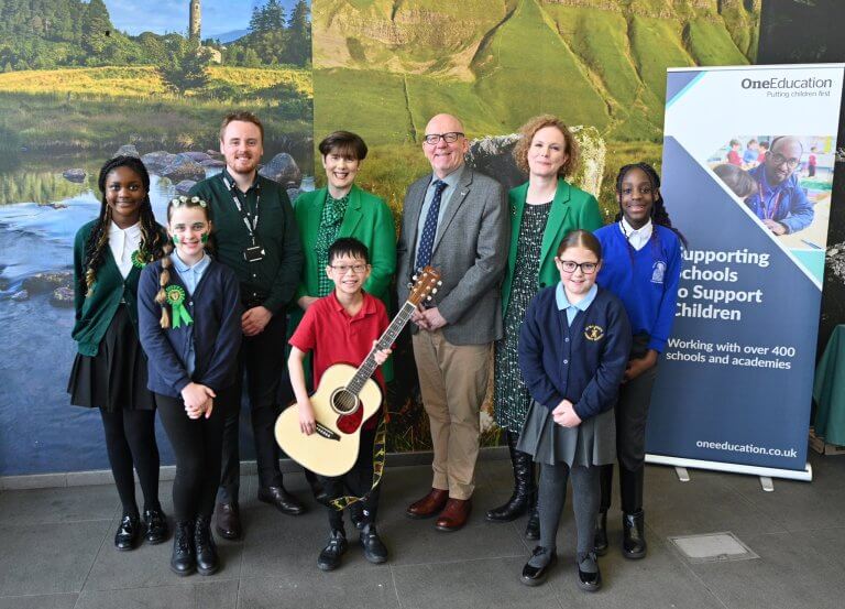Adam Cooke, head of Music Service at One Education, Norma Foley, Irish Education Minister, Stuart Fern, Chief Executive of One Education, and Sarah Mangan, Consul General of Ireland in Manchester, together with pupils from Manchester schools
