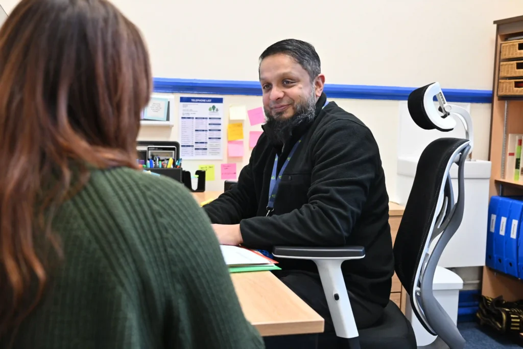 Business manager chats to colleague