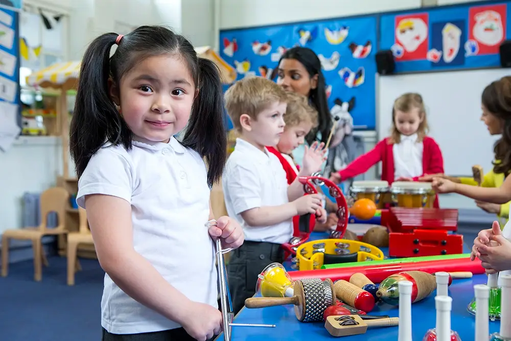 early years pupil with music intruments