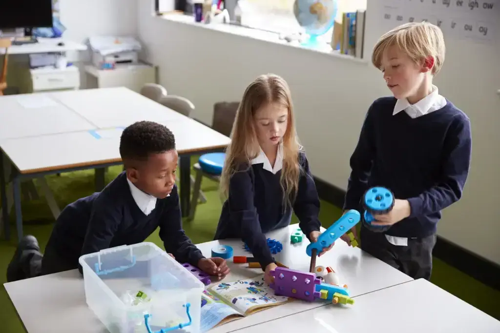 elevated-view-of-three-primary-school-pupils-working