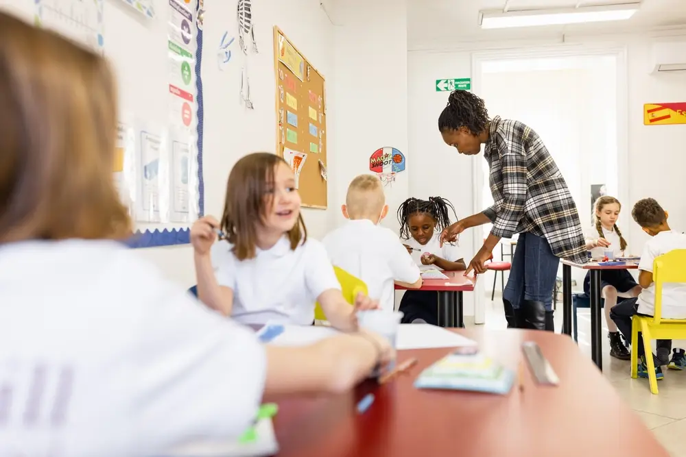 pupil in a classroom with classmates