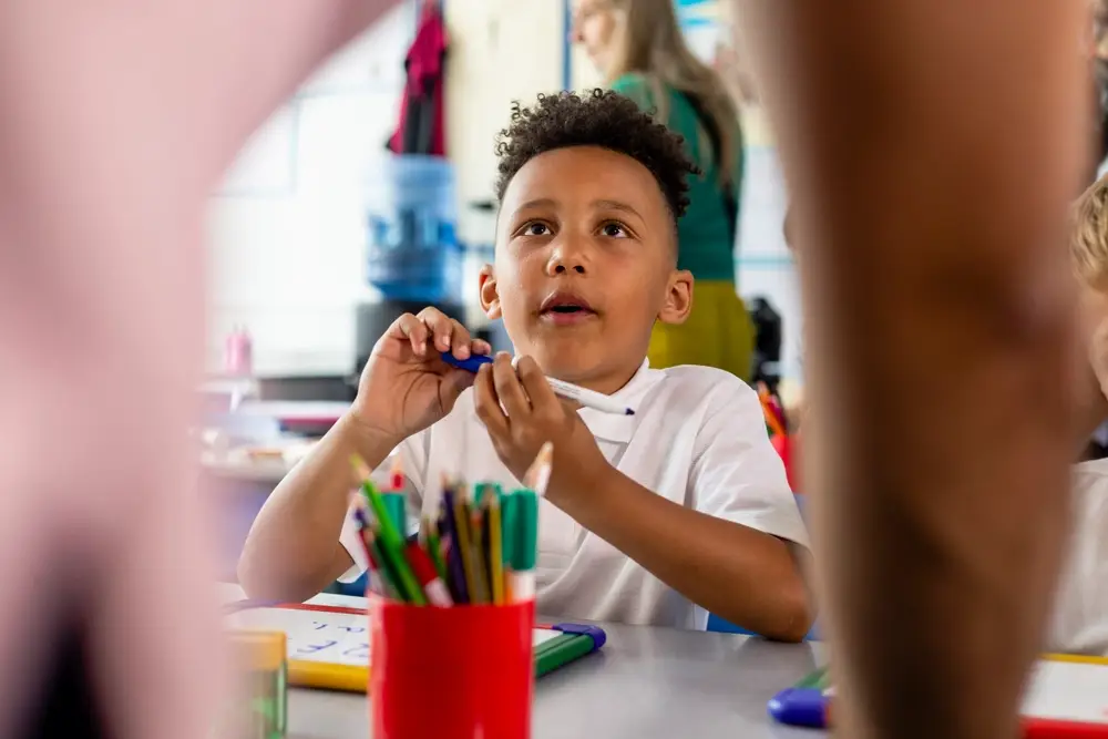 pupil looks up to teacher