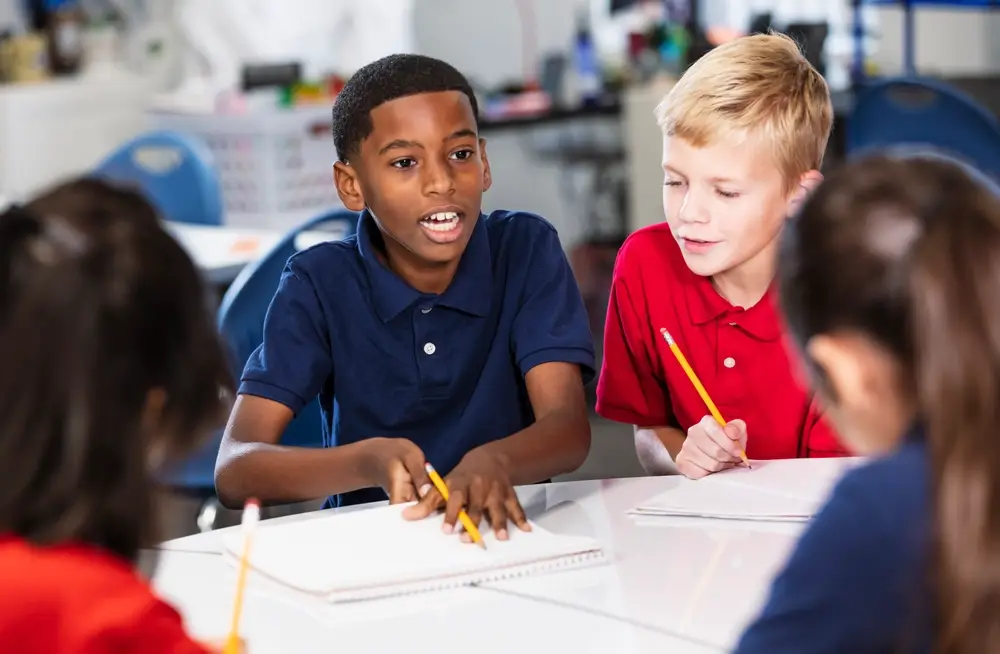 2 pupils discuss their work