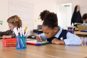 pupil writes on pad