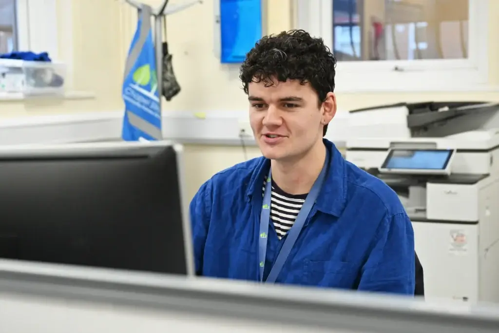 support staff member at screen