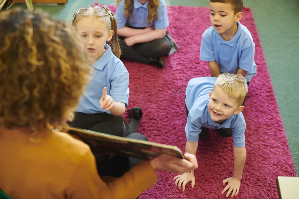 teacher reading book to pupils