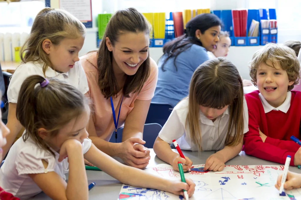 teacher with group of EYFS pupils