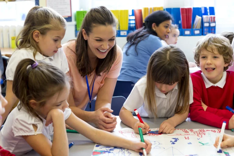 teacher with group of EYFS pupils