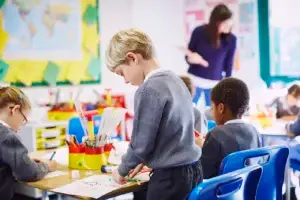 children crafting together in a bright classroom