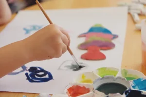 child creates art with colorful paints at home 2026 03 10 01 04 36 utc