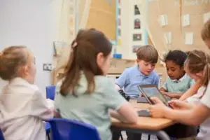 children learning together with tablets in school 2026 03 25 01 01 14 utc