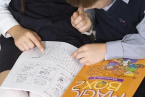 children sit on the floor and do the task they wer 2026 03 16 04 41 57 utc