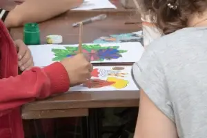 kids paint together at table in home setting 2026 01 07 00 33 46 utc