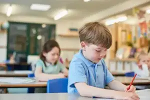 schoolboy counting writing in classroom lesson at 2026 03 25 00 52 22 utc