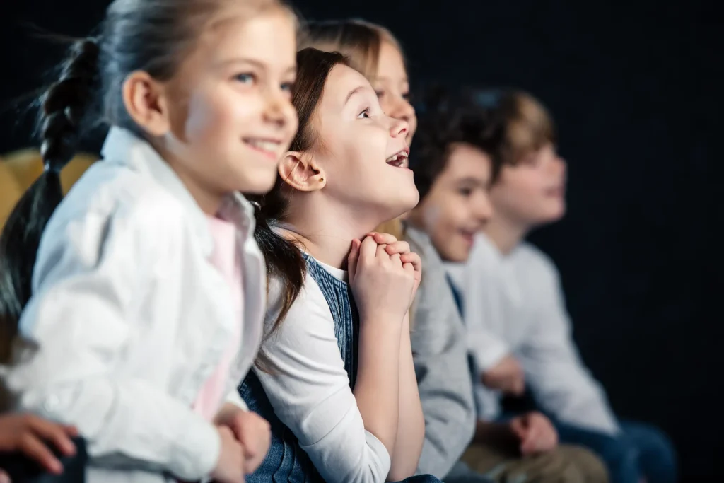 selective focus of excited friends sitting in cine 2026 03 11 04 19 50 utc