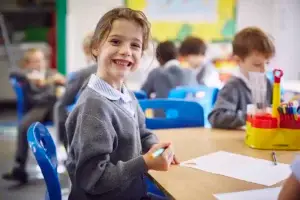 smiling child enjoying class activities at school 2026 01 09 10 57 45 utc
