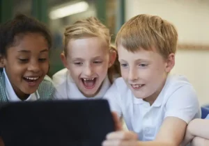smiling children looking at a tablet screen togeth 2026 03 25 02 18 42 utc copy