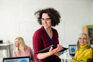 smiling professional working with colleagues in of 2026 01 05 22 52 54 utc