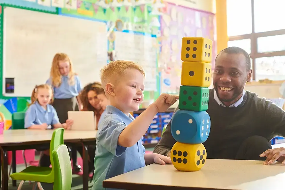teacher and pupil counting with dice